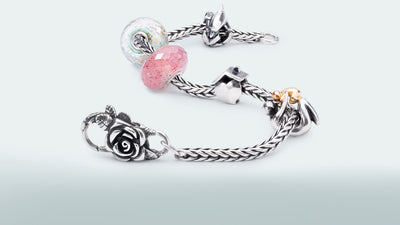 Trollbeads bracelet with Rose Lock, Maternity Dolphin Spacer, Strawberry Quartz, Meditation, Home