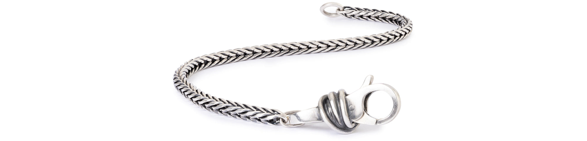Sterling silver bracelet with Lucky Knot clasp on white background