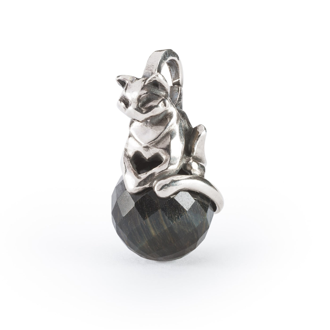 Jewellery silver cat pendant sitting on a ball of Blue Tiger Eye gemstone.