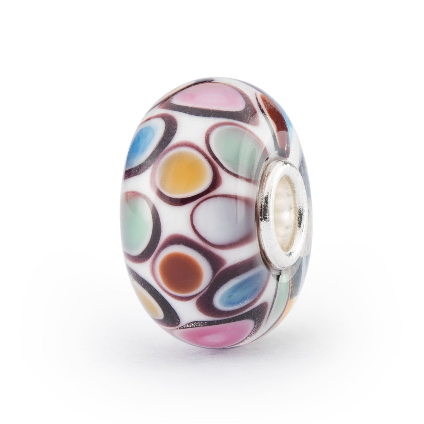 Pink, yellow, blue and pale green dots framed in white and black spread over a white surface in this round glass bead.