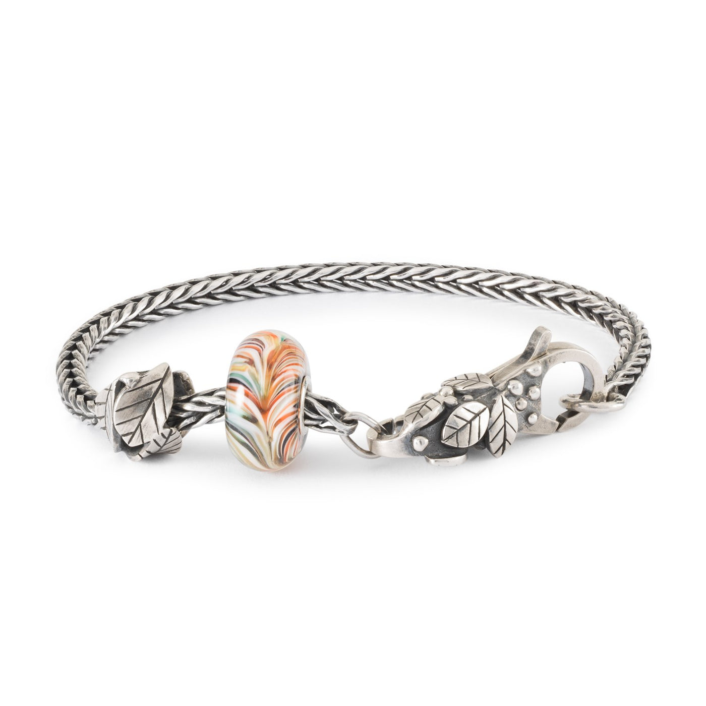 A stylish silver bracelet featuring a Wings of Freedom glass bead and  a silver Departure bead, with a Safe Space clasp for a secure fit.