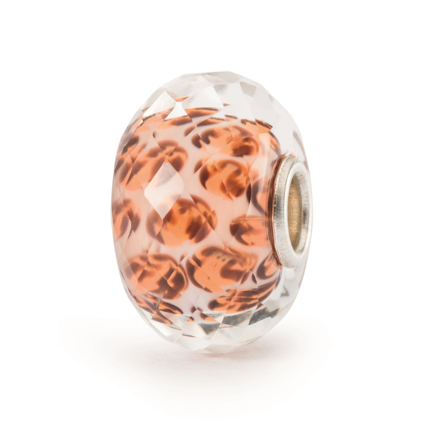 A beautiful faceted glass bead with a leopard spot pattern resembling that of a leopard. The spots are a mix of orange, and light brown tones on a beige background.