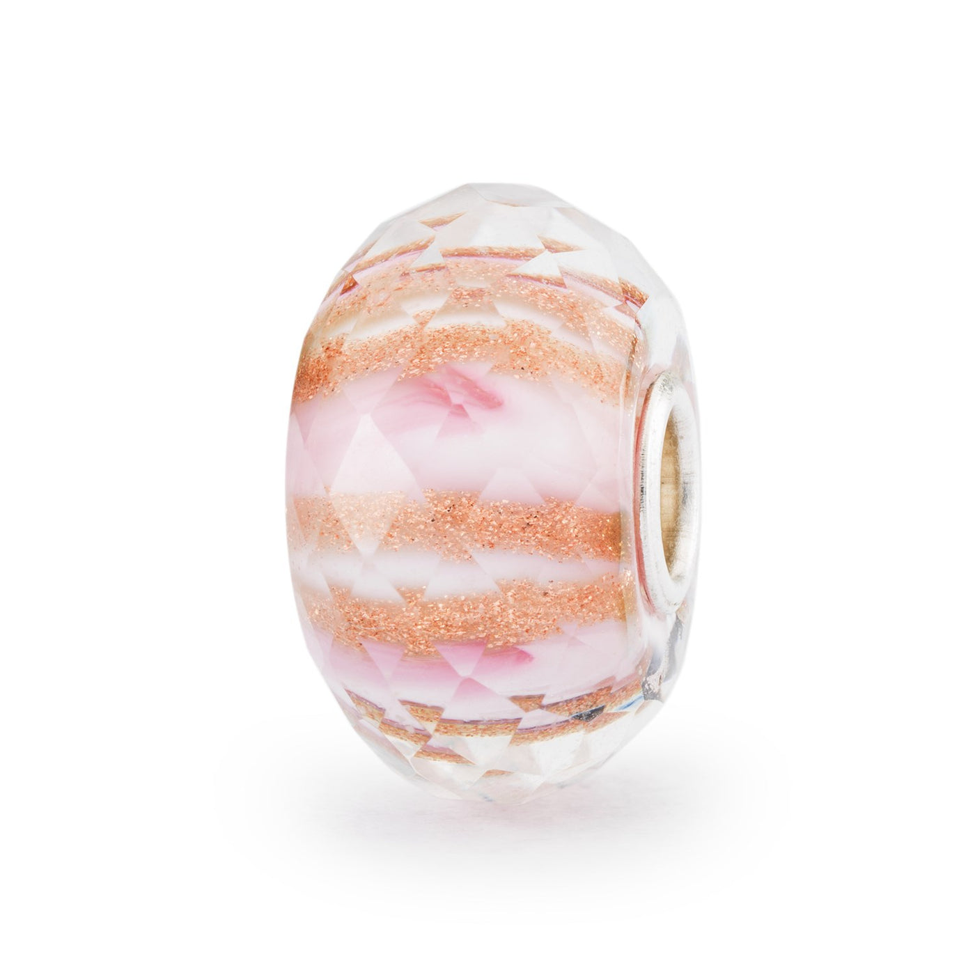 A lovely faceted glass bead with a soft pink hue and gold glimmer patterns.