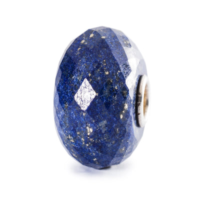 Lapis lazuli bead with faceted cut, deep blue color, and golden sparkle, adding a touch of richness and elegance to your jewelry.