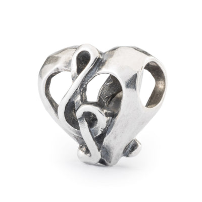 Love Song silver bead contains a musical G-note inside a heart design, symbolizing the melody of love, for your Trollbeads bracelet.