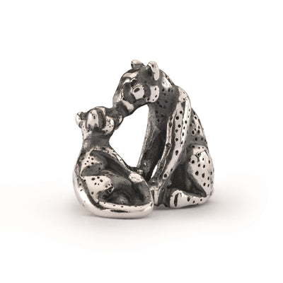 A leopard mom and her cub cast in sterling silver. Their faces meet in a sweet embrace and their tails curl about their dotted bodies in a joyous motion.
